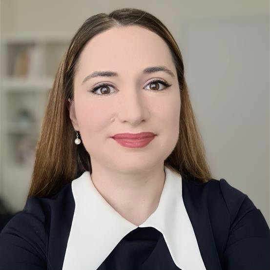 Shows woman wearing  navy blouse