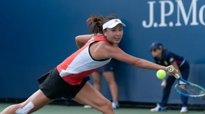 Shuai Peng (China) returns ball during US Open Tennis Championship.