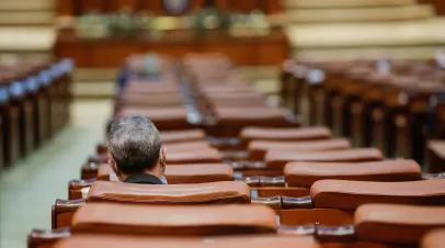 Romanian member of parliament attends a Parliament's session in the Chamber of Deputies hall of the Palace of Parliament.