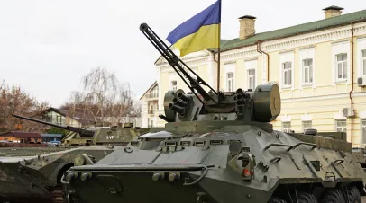 Army troops transporter and tank with Ukrainian flag