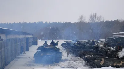 Tanks with tankers turn around and go to the training ground