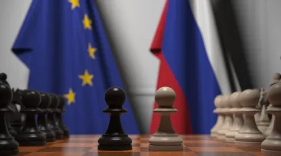 Flags of the EU and Russia behind chess board. The first pawn moves in the beginning of the game. Political rivalry conceptual 3D rendering