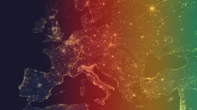 The picture shows europe at night with a rainbow filter over it 