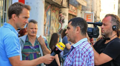 Journalist reports live the protest at Istiklal Street. 