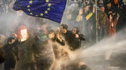 Protesters raise a EU flag