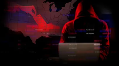 hacker on image in front of united states map