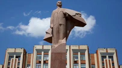 TIRASPOL, TRANSNISTRIA – CIRCA JULY 2017: Statue of Vladimir Lenin in Tiraspol on July 2017. Transnistria parliament building in Tiraspol. In front is a statue of Vladimir Lenin.