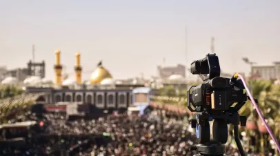 video camera and crowd