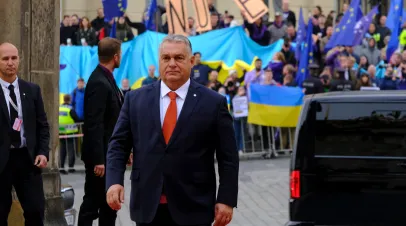 Hungarian Prime Minister Viktor Orban in front of Ukrainian and EU Flags Hungarian Prime Minister Viktor Orban in front of Ukrainian and EU Flags