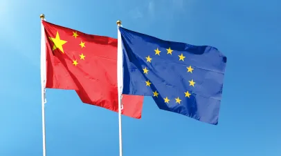 Chinese and European Union flags flying