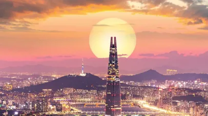 Skyline of Seoul, South Korea with a sunset behind it 