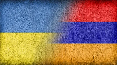 Ukrainian and Armenian flag on concrete