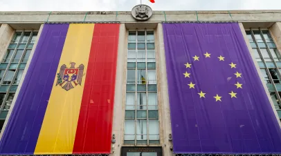 Large flags of the Republic of Moldova and the European Union on the building of the government of Moldova on the eve of the summit of the European Political Community.