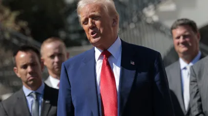 Trump standing in front of three other men