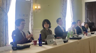 Event photo of people speaking on a panel