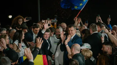 Romanian presidential candidate Nicursor Dan greeting a crowd of supporters
