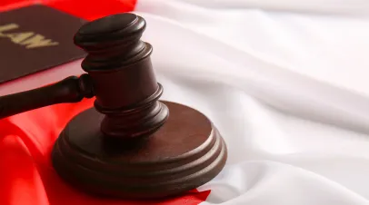 Gavel sitting on top of a polish flag