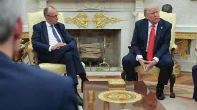 German Chancellor Merz and President Trump sitting together in the White House