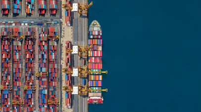 Aerial view of cargo ship and shipping yard
