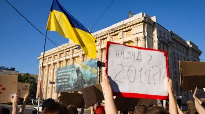 Protestors in Ukraine holding signs