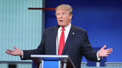 Republican presidential candidate Donald Trump fields a question during the first Republican presidential debate hosted by Fox News and Facebook at the Quicken Loans Arena on August 6, 2015 in Cleveland, Ohio. The top ten GOP candidates were selected to participate in the debate based on their rank in an average of the five most recent political polls.