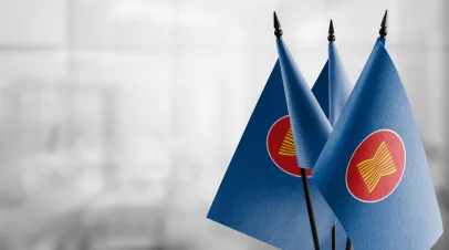 Small flags of the ASEAN on an abstract blurry background