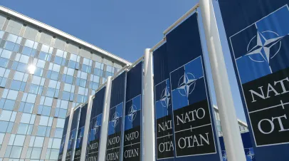 NATO logo flags in front of the headquarters building in Brussels, Belgium, 2022