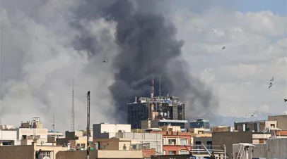 Plumes of smoke rise over the skyline following explosions on March 1, 2026 in Tehran, Iran. Iran's Supreme Leader, Ayatollah Ali Khamenei, was confirmed killed after the United States and Israel launched a joint attack on Iran on February 28. Iran retaliated by firing waves of missiles and drones at Israel, and targeting U.S. allies in the region.