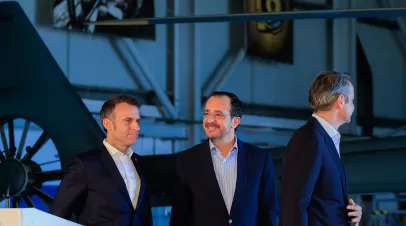 In this handout photo provided by the Cyprus Press and Information Office, President of France Emmanuel Macron (L), President of Cyprus Nikos Christodoulides (C) and Prime Minister of Greece Kyriakos Mitsotakis (R) hold a joint press conference at Paphos Military Base on March 9, 2026 in Paphos, Cyprus.