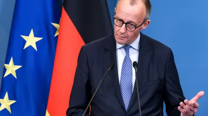 German Chancellor Merz speaks at a conference.