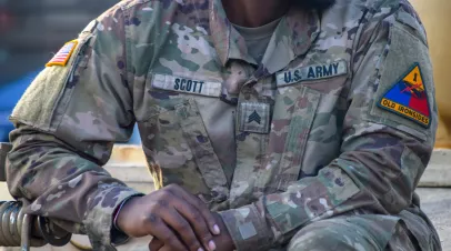 Łódź, Poland, NOV11,2023: United States Army Garrison Poland. Close up photo with the flag of America and Insignia on soldiers shoulder uniform, US army concept image.