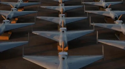 U.S. CENTRAL COMMAND AREA OF RESPONSIBILITY (Nov. 23, 2025) Low-cost Unmanned Combat Attack System (LUCAS) drones are positioned on the tarmac at a base in the U.S. Central Command (CENTCOM) operating area, Nov. 23. The LUCAS platforms are part of a one-way attack drone squadron CENTCOM recently deployed to the Middle East to strengthen regional security and deterrence. (Courtesy Photo)