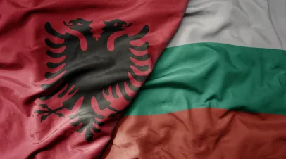 big waving national colorful flag of albania and national flag of bulgaria . macro
