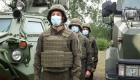 Ukraine Soldiers of the National Guard in body armor near the armored vehicle