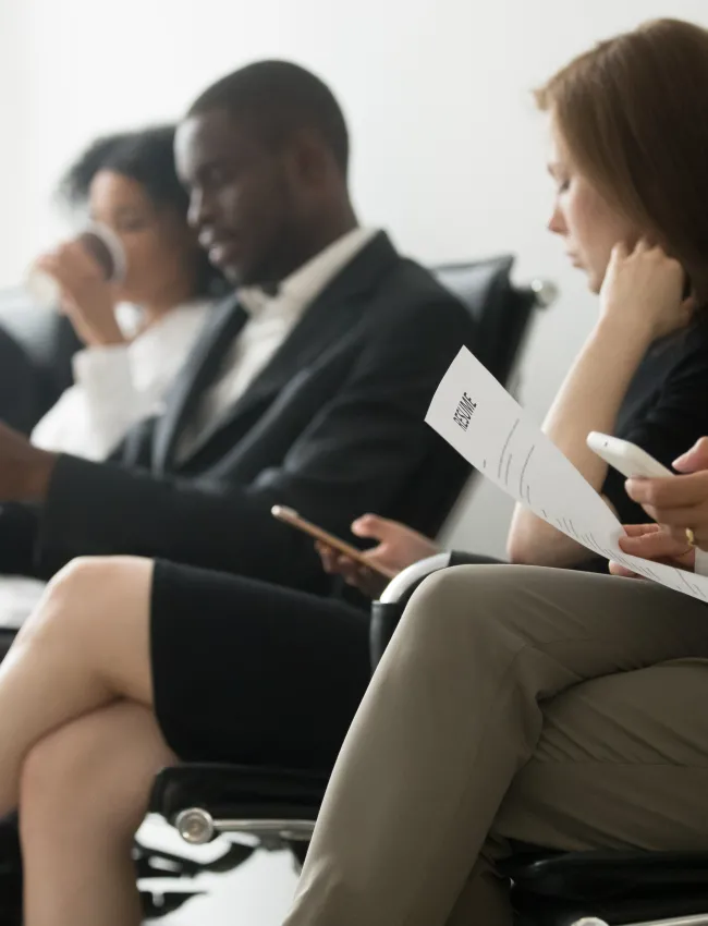 Applicants sitting in queue preparing for interview