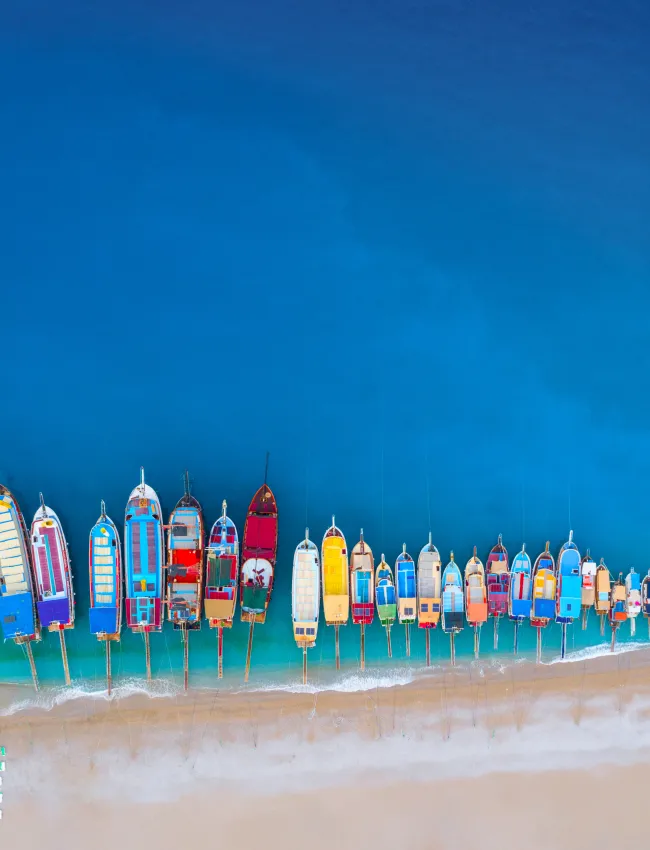 Aerial view of colorful boats in Mediterranean sea