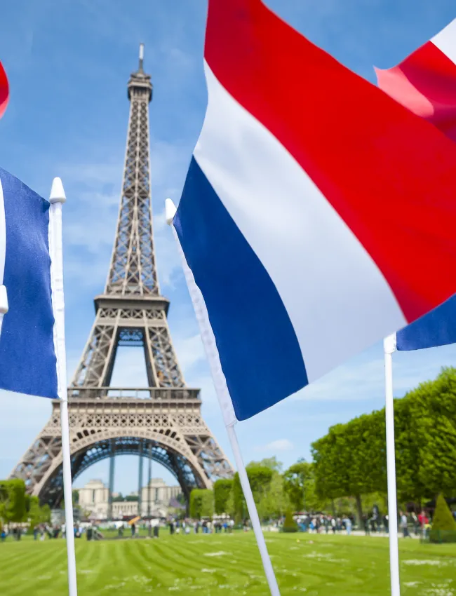 French flags in front of the Eiffel Tower