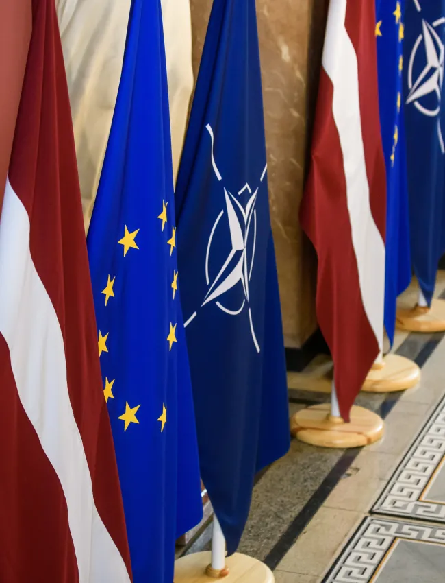 Latvian, EU, and NATO flags