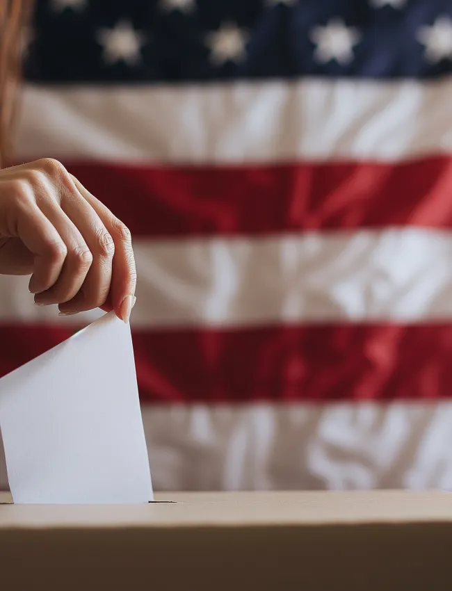 Shallow depth of field (selective focus) image with the hand of a person voting in the US presidential elections.