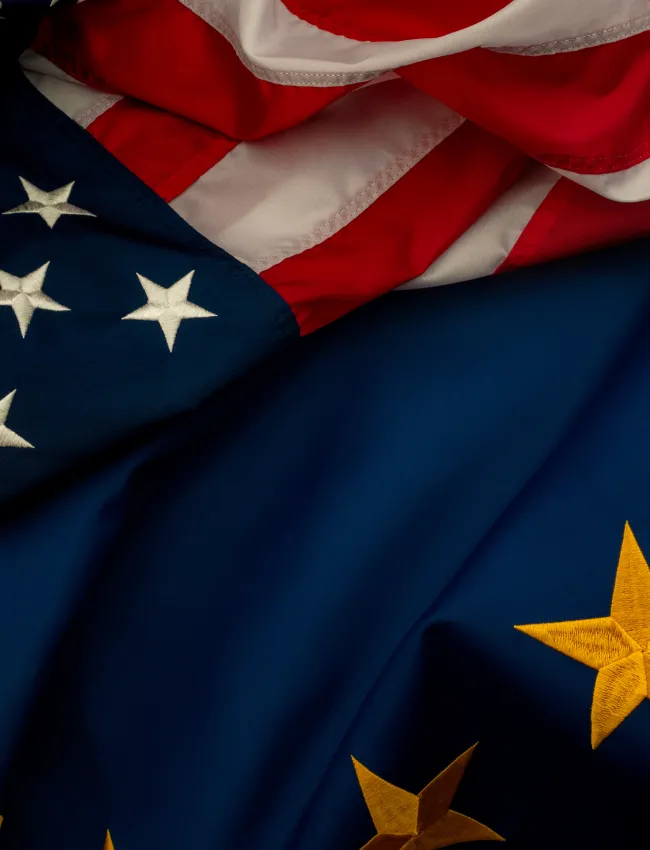 US and EU flags lying on top of one another