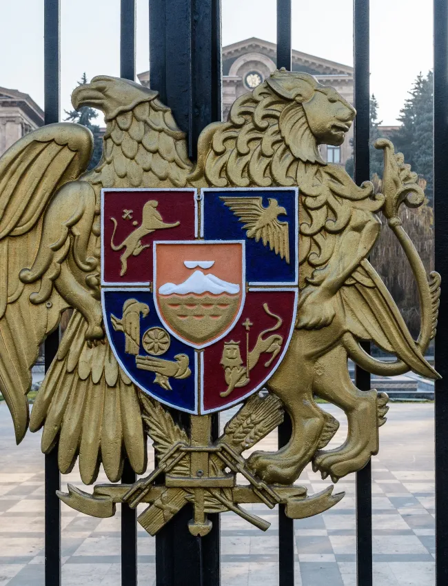 Yerevan, Armenia - 3 January, 2023: The state emblem of Armenia on a cast-iron fence around the National Assembly of Armenia (Parliament of Armenia).