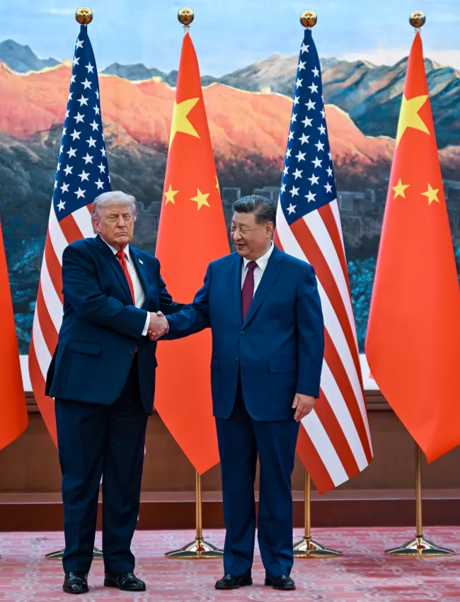  U.S. President Donald Trump (L) and Chinese President Xi Jinping participate in a welcoming ceremony at the Great Hall of the People on May 14, 2026 in Beijing, China.