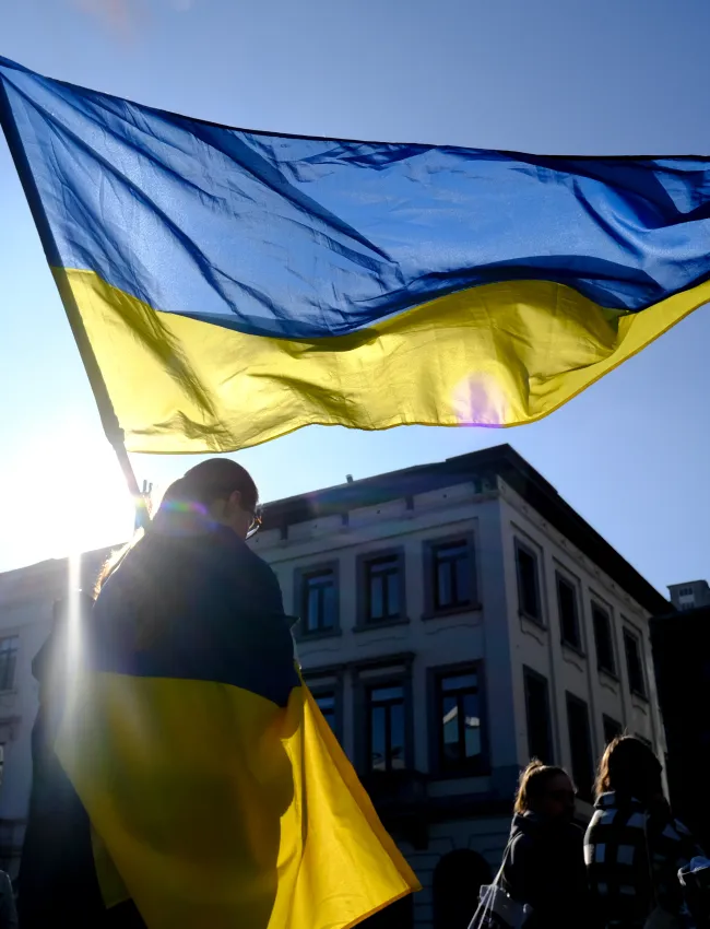 girl holding ua flag