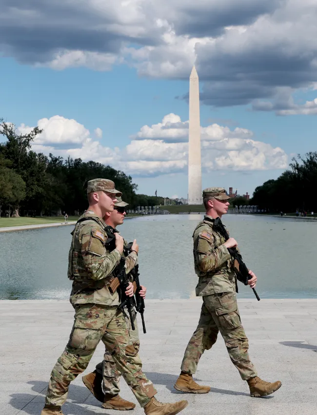 soldiers next to Washington monument