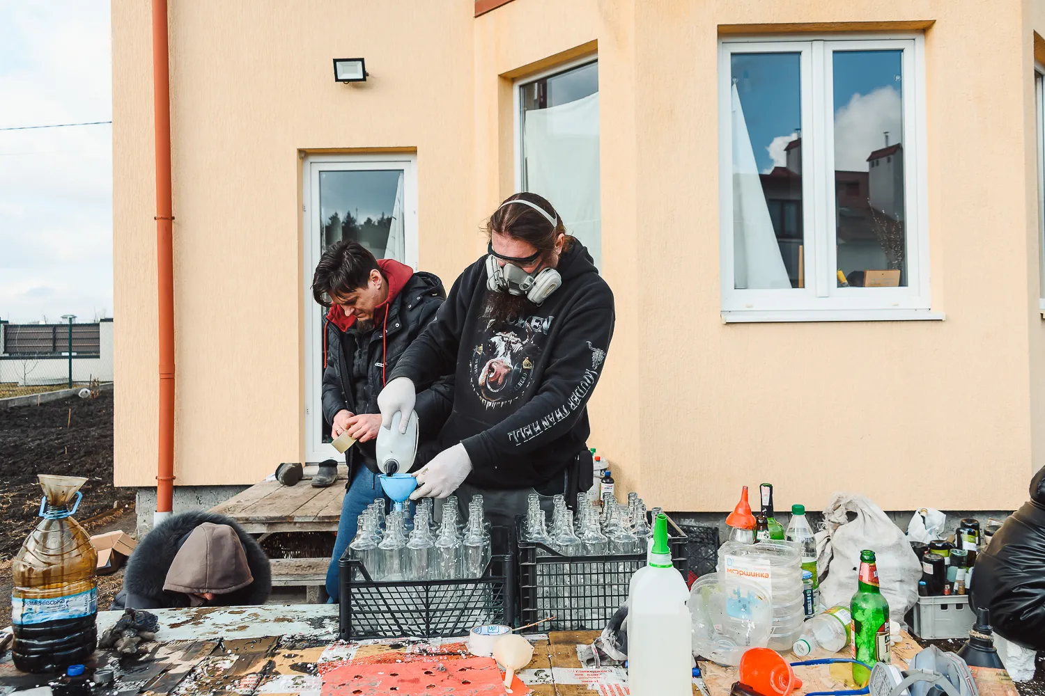 Making Molotov cocktails in the backyard of a private house. Zapytiv, Halychyna. 26 February, 2022